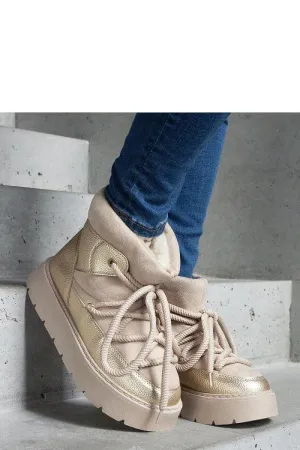 Beige snow boots on the platform