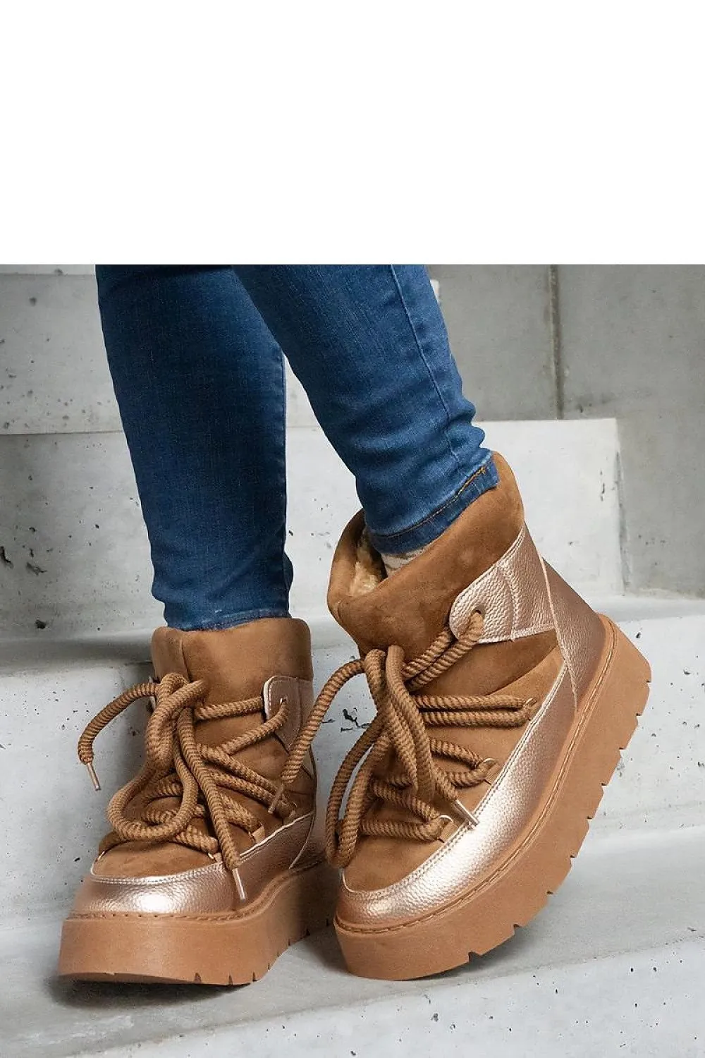 Beige snow boots on the platform