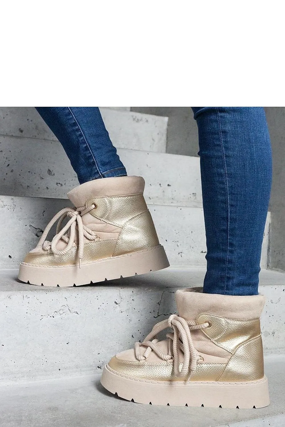 Beige snow boots on the platform