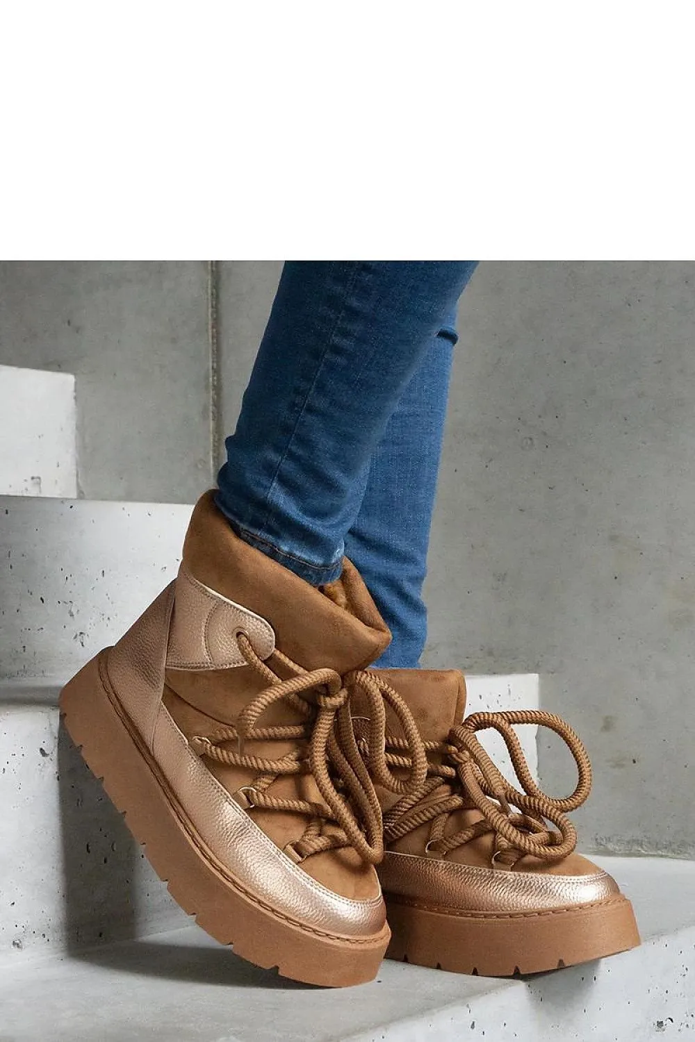 Beige snow boots on the platform