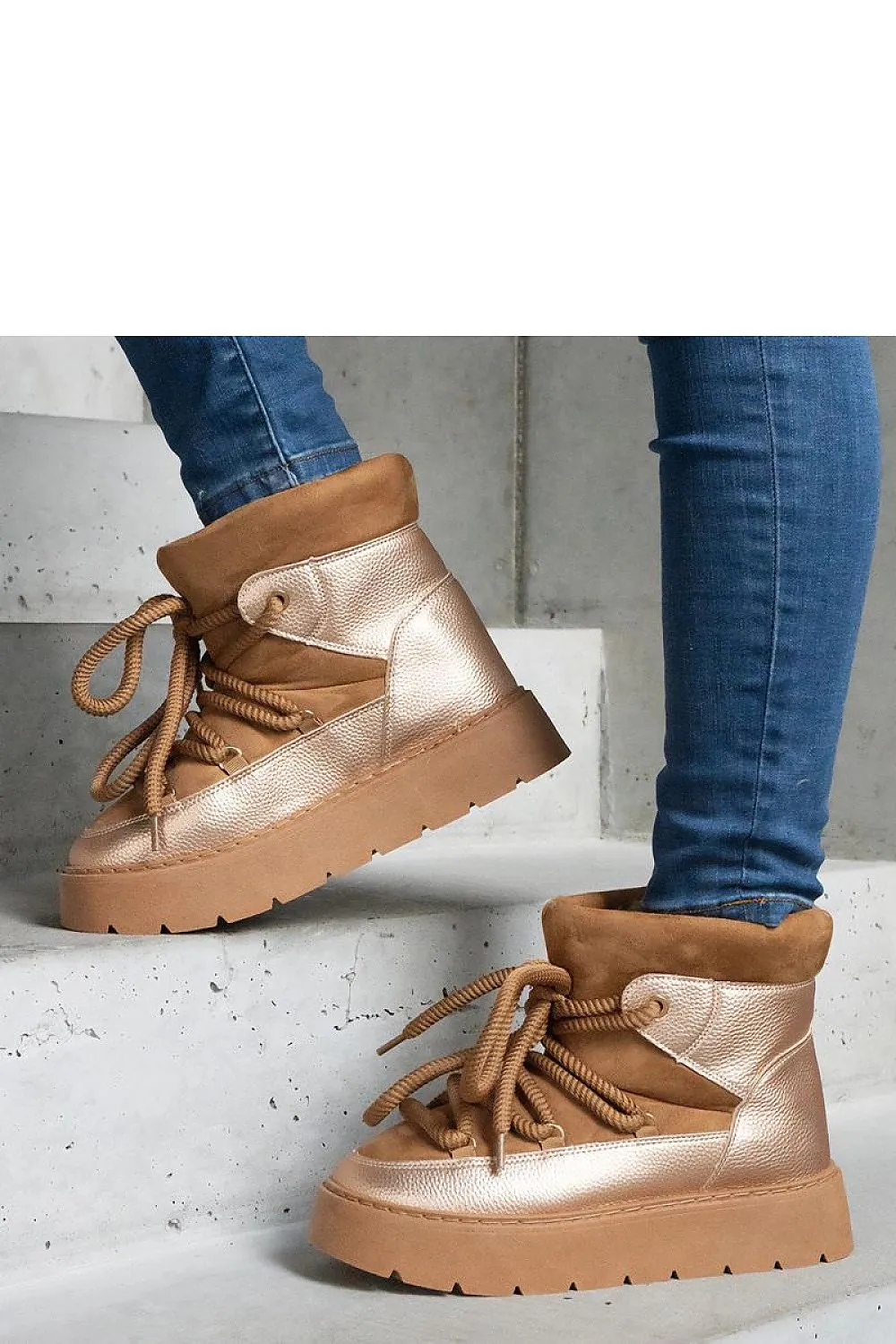 Beige snow boots on the platform