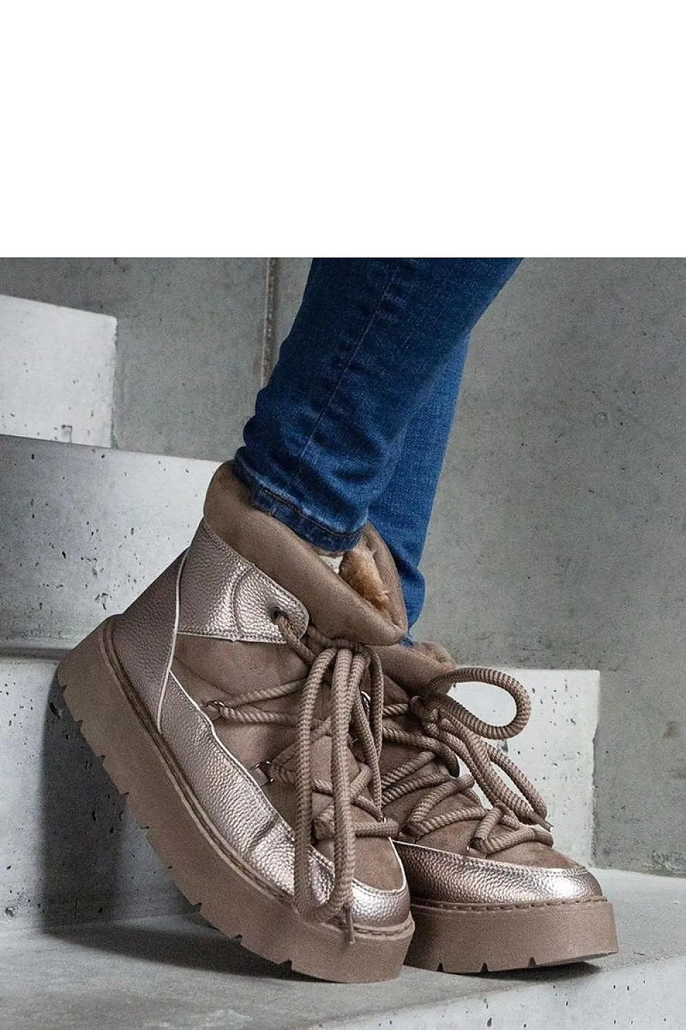 Beige snow boots on the platform