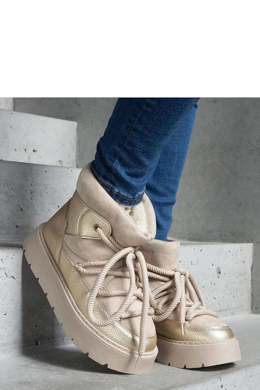 Beige snow boots on the platform