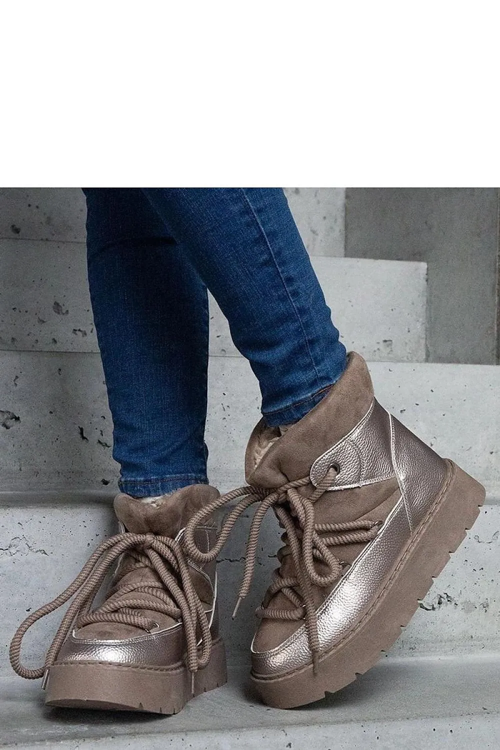 Beige snow boots on the platform