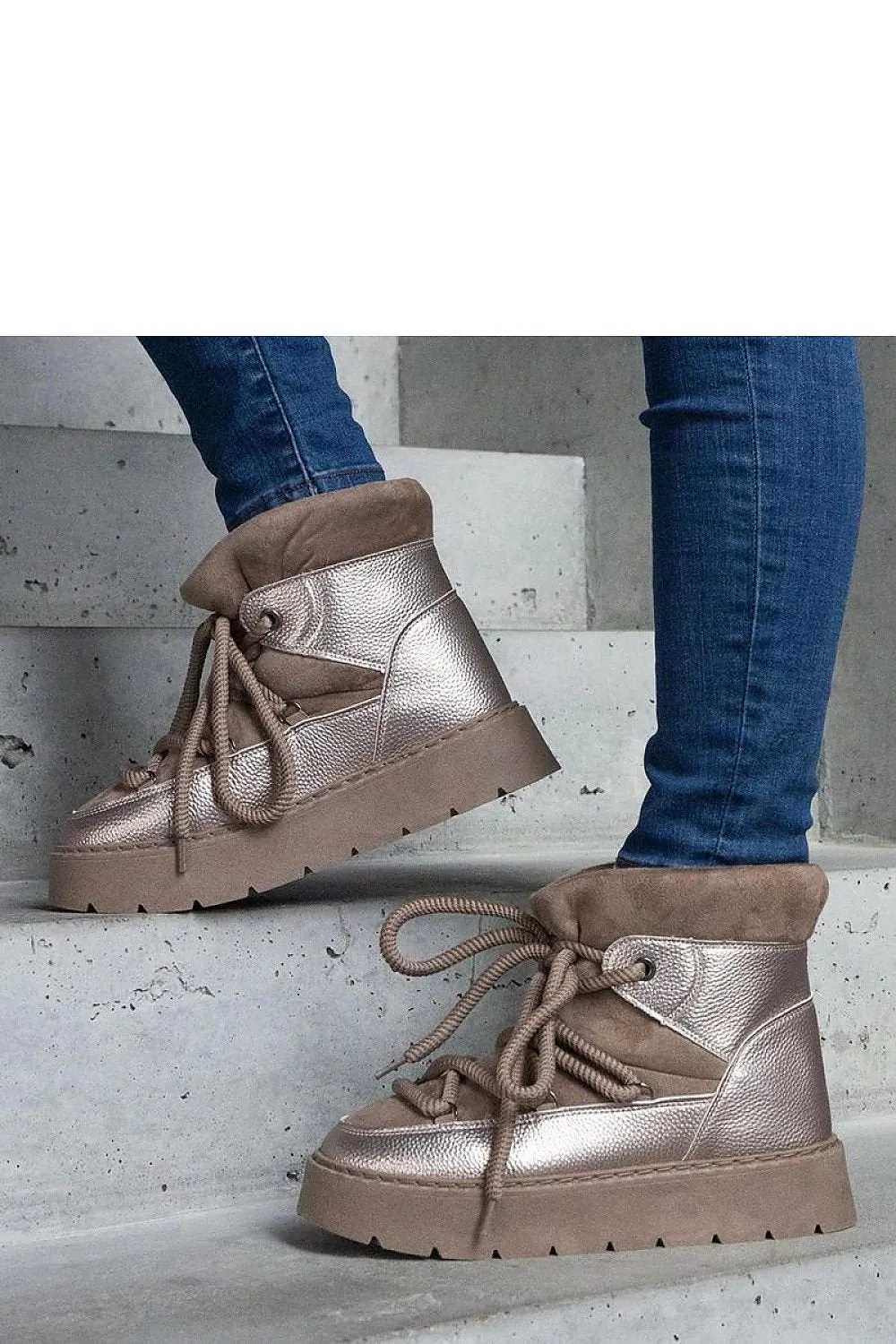 Beige snow boots on the platform