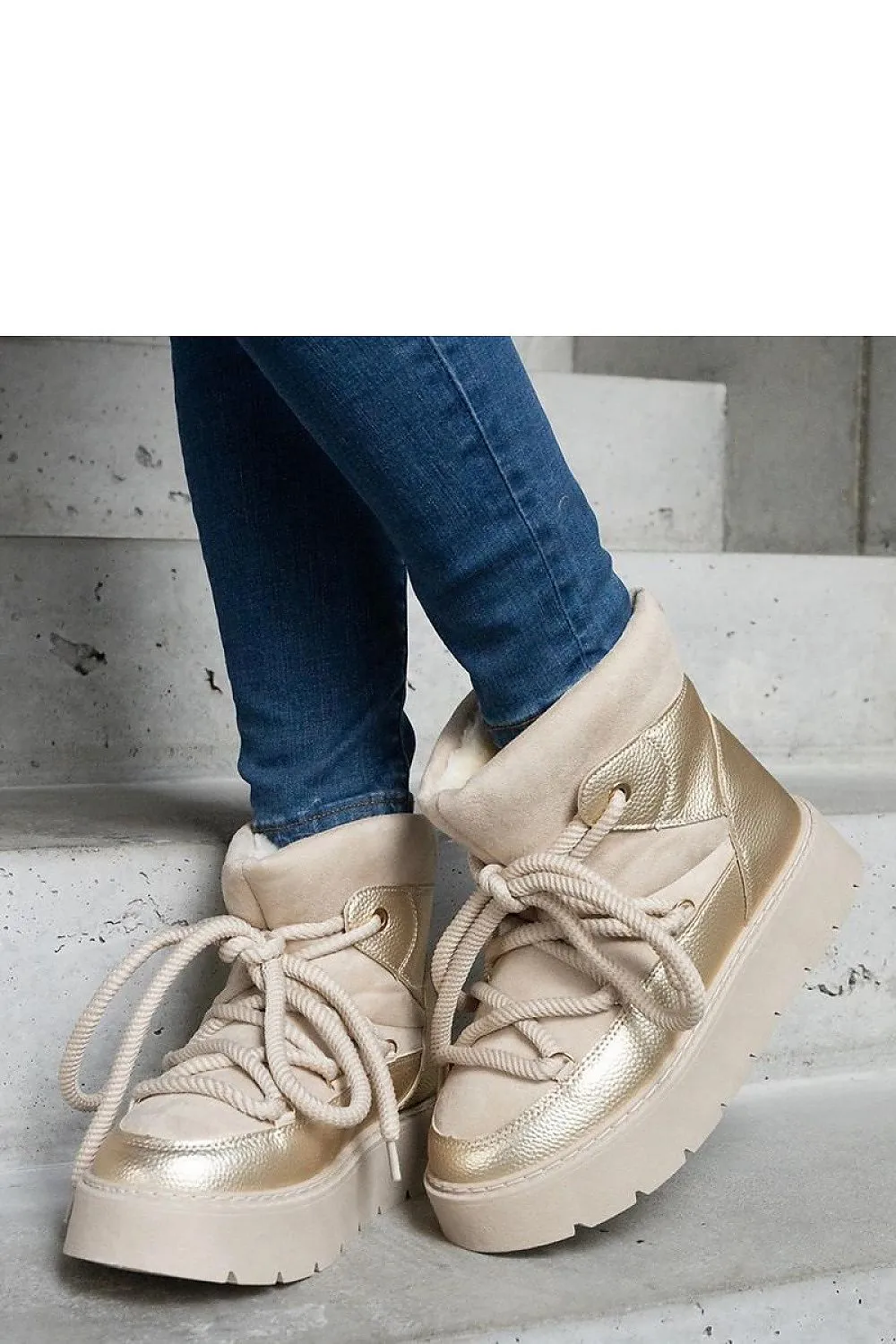 Beige snow boots on the platform